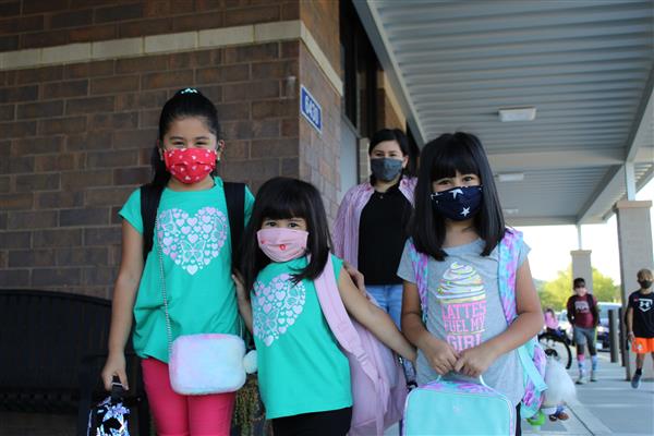 students smile on first day of school